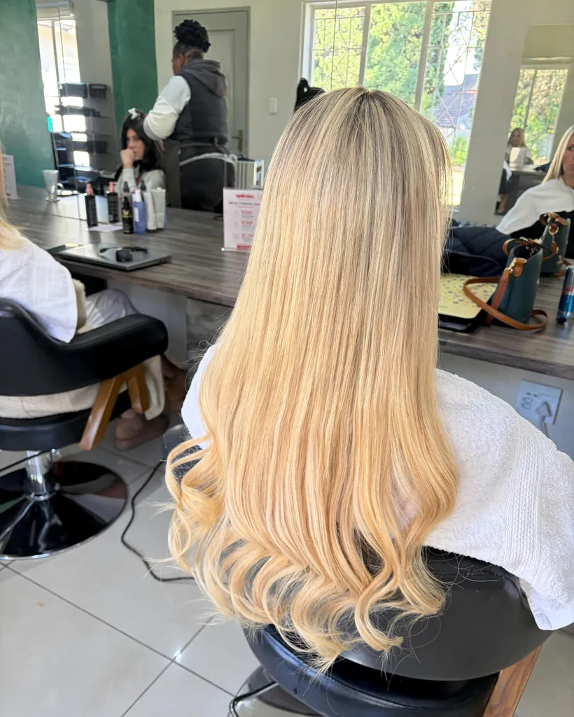After &mdash; five packs of tape-in extensions blended through blonde hair, The Edit by K.C Dunkeld West