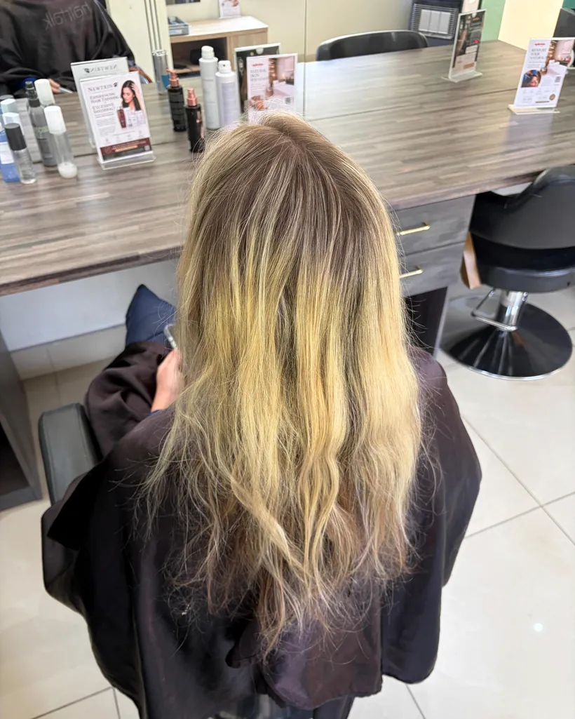 Before &mdash; dry, uneven blonde lengths before tape-in extensions