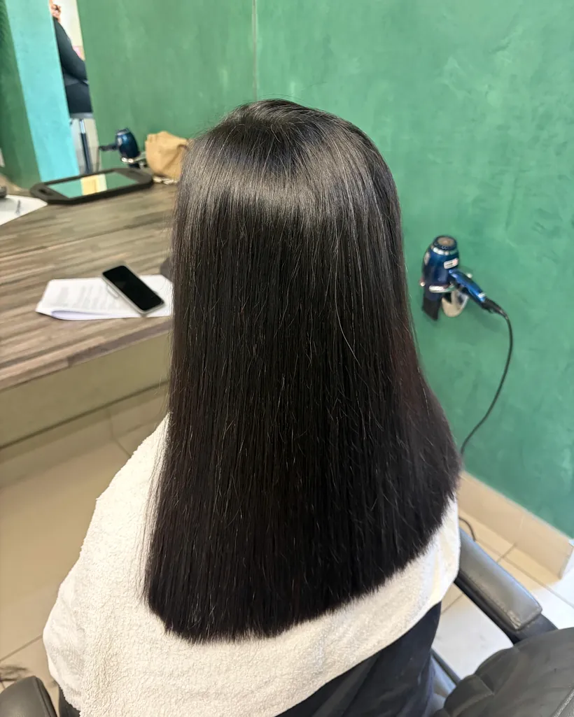 After &mdash; three packs of tape-in extensions adding volume to a shoulder-length cut