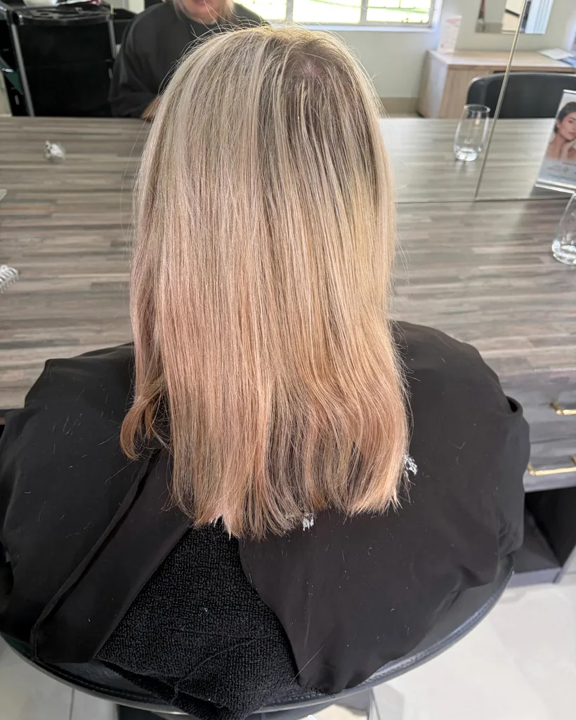 Before &mdash; beige-blonde hair cut to a blunt shoulder-length bob